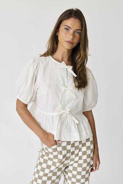 Atlas bow peplum top in off white