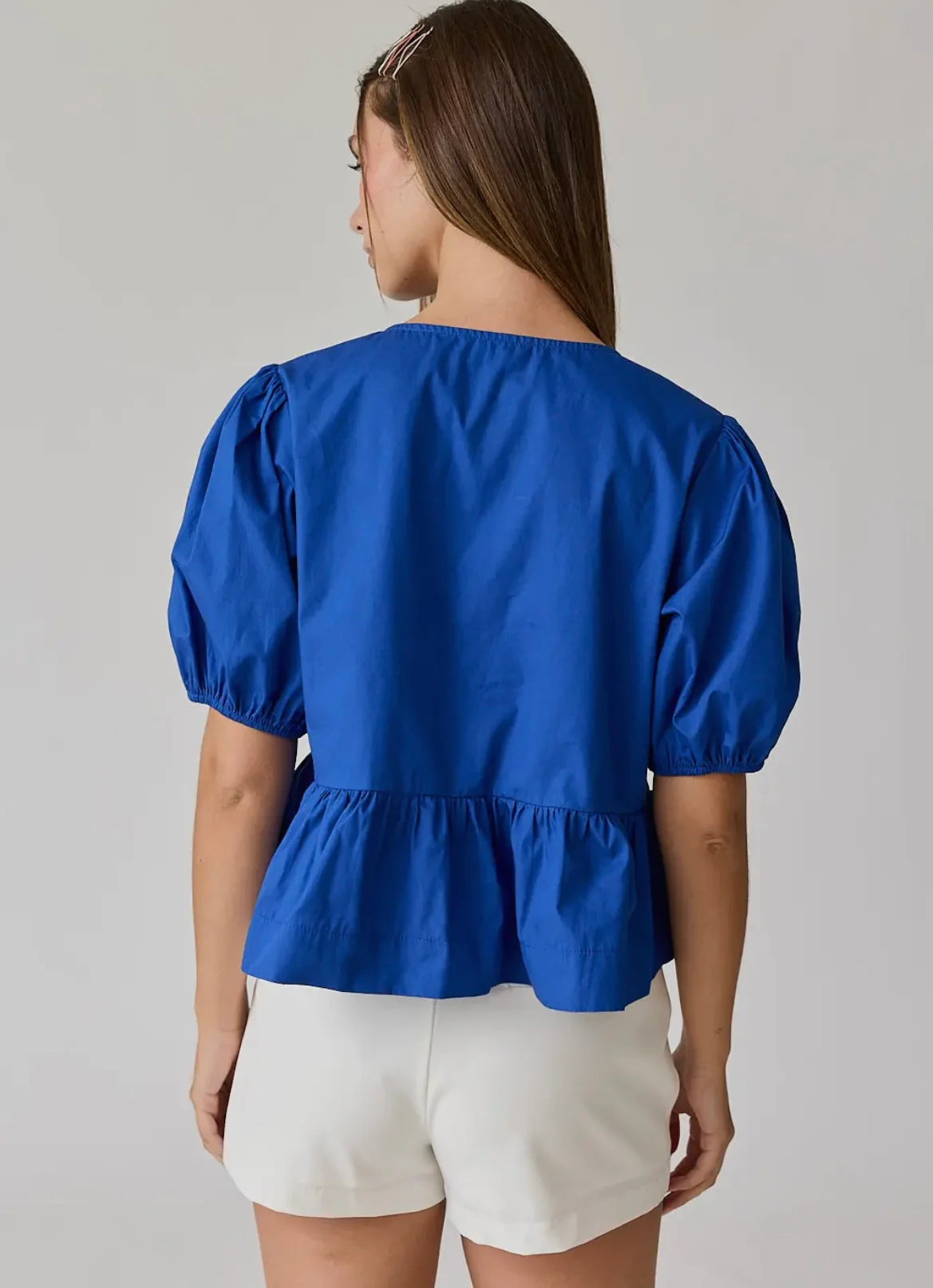 Atlas bow peplum top in blue