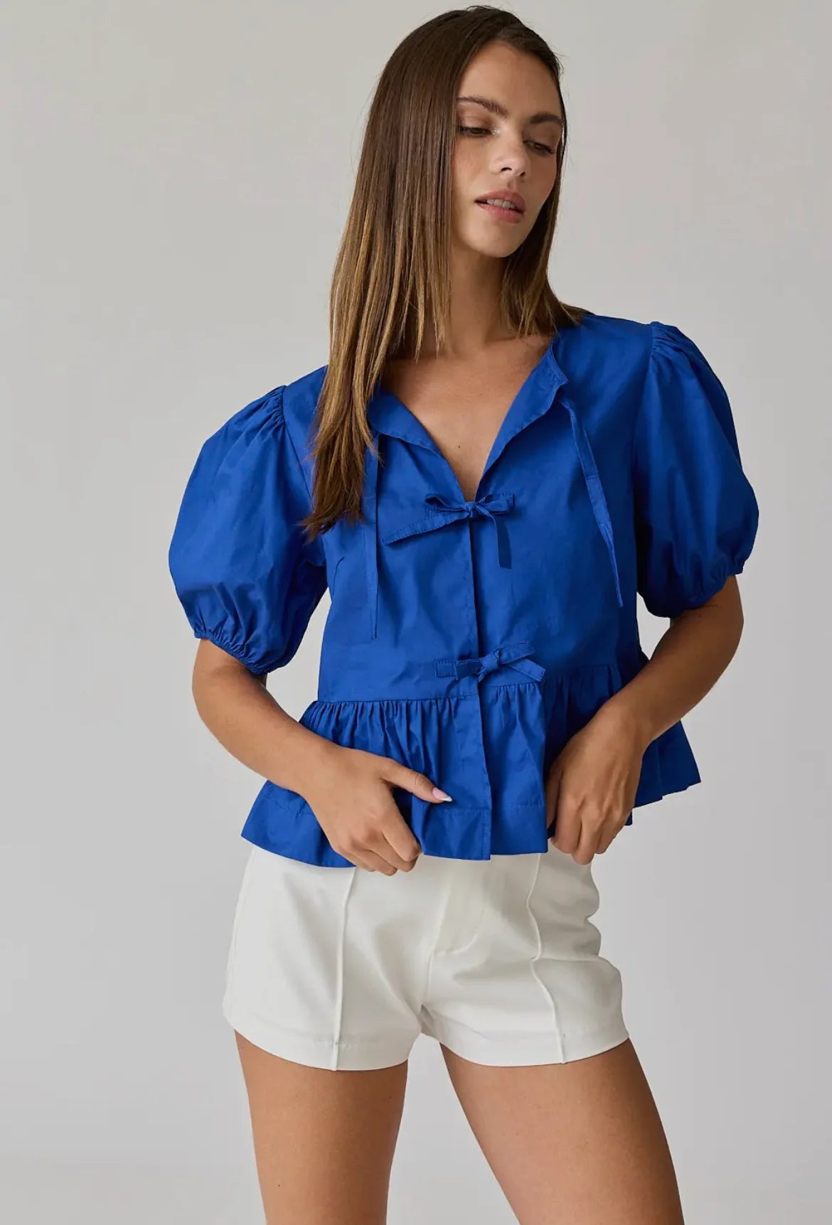 Atlas bow peplum top in blue