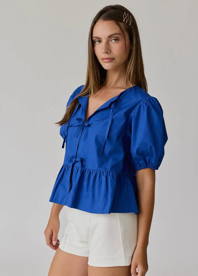 Atlas bow peplum top in blue